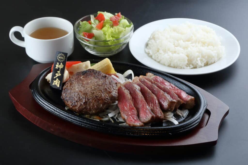 a plate of food with a bowl of salad and a bowl of rice