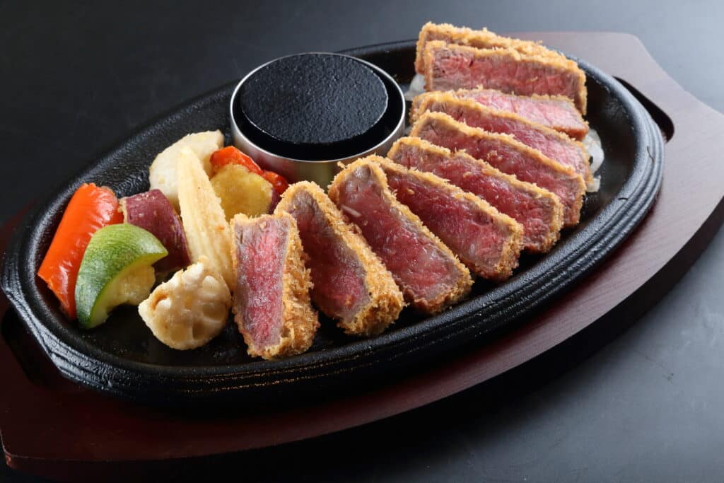 a plate of meat and vegetables