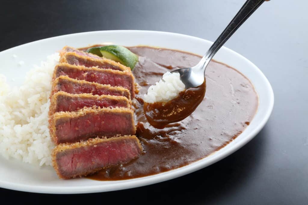 a plate of food with a spoon