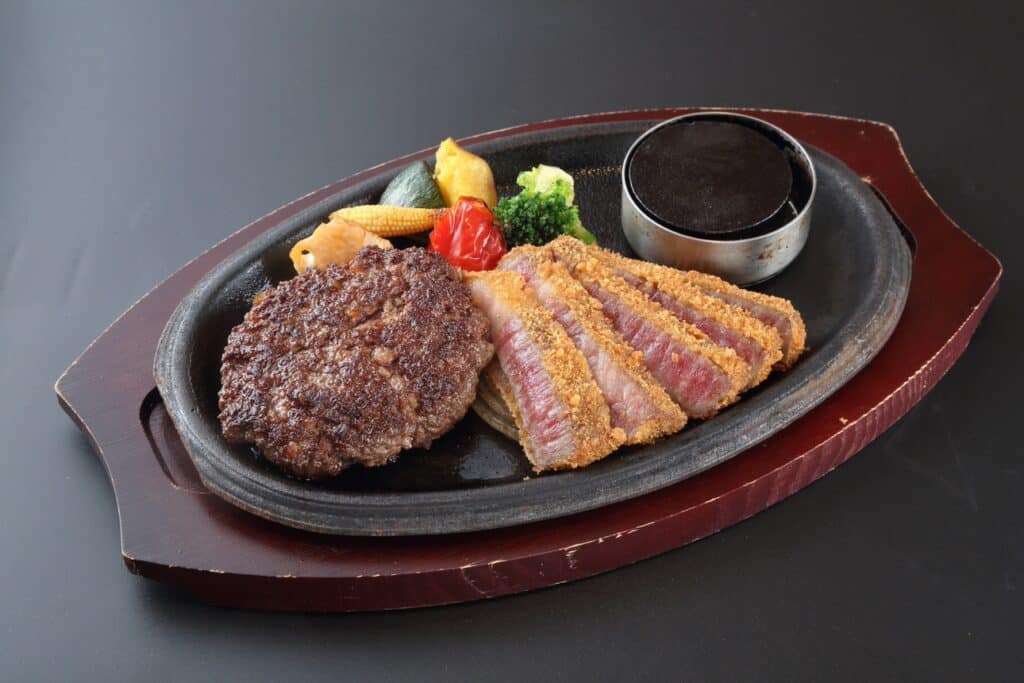 a plate of food on a black surface