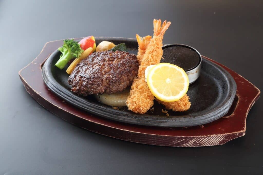 a plate of food on a black surface