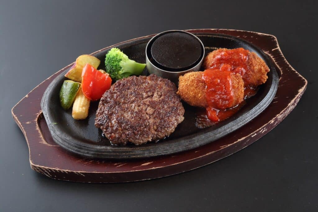 a plate of food on a black surface