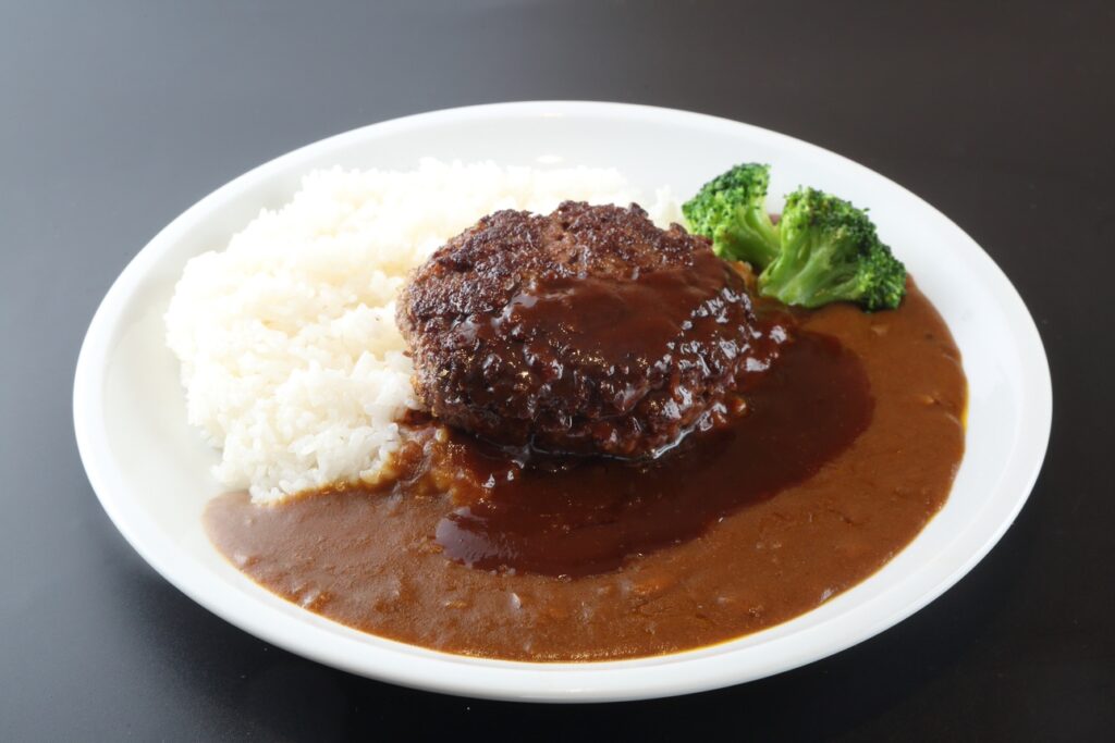 a plate of food with rice and meat