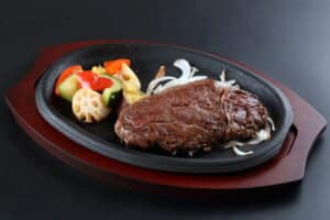 ブログ a plate of food on a black surface